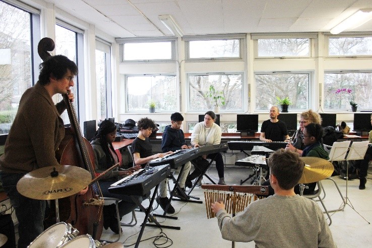 OAE musicians run a workshop in a school classroom