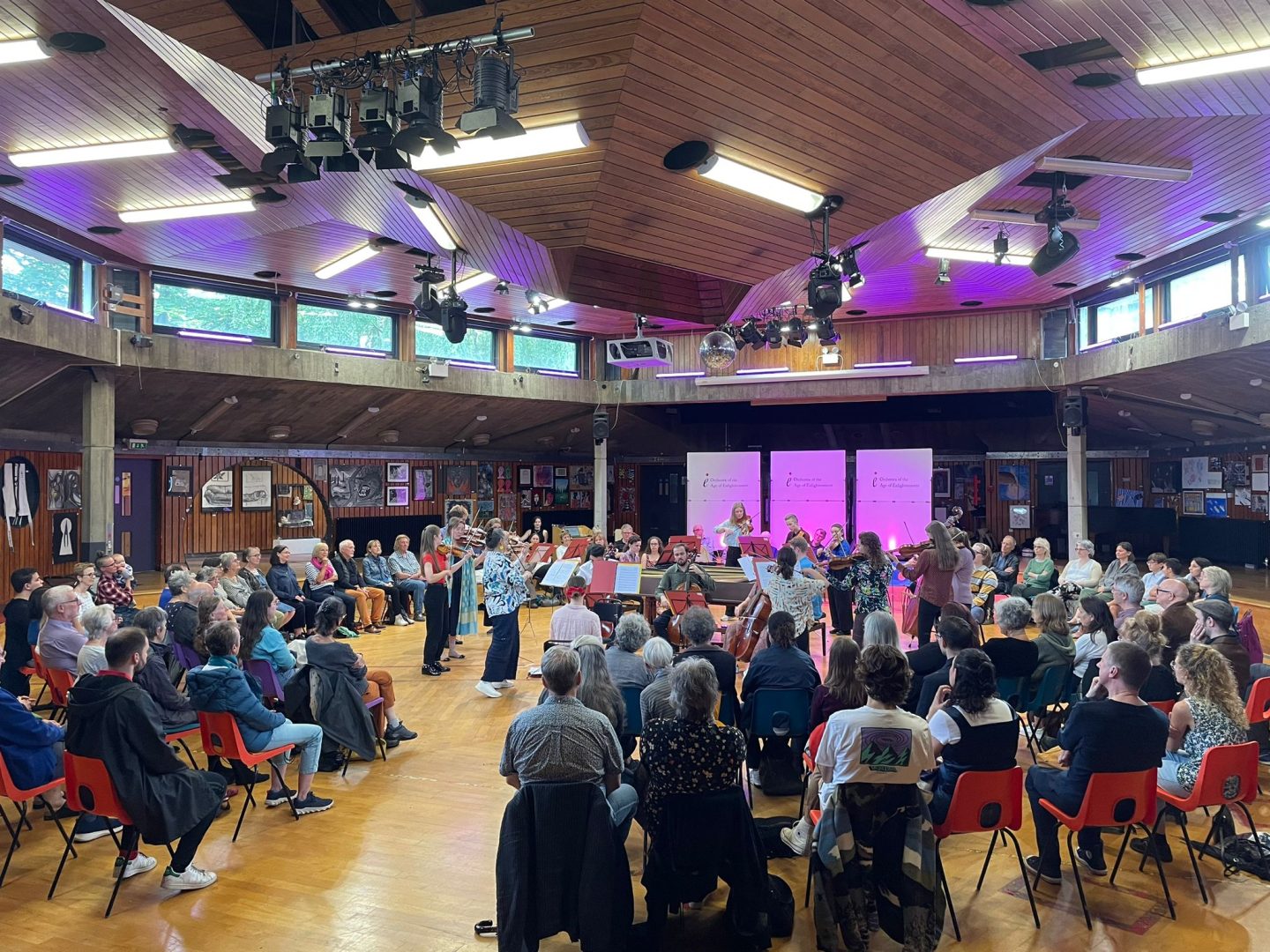 The OAE Experience ensemble, a group of early career musicians, performing to a community audience in the Assembly Hall at Acland Burghley School